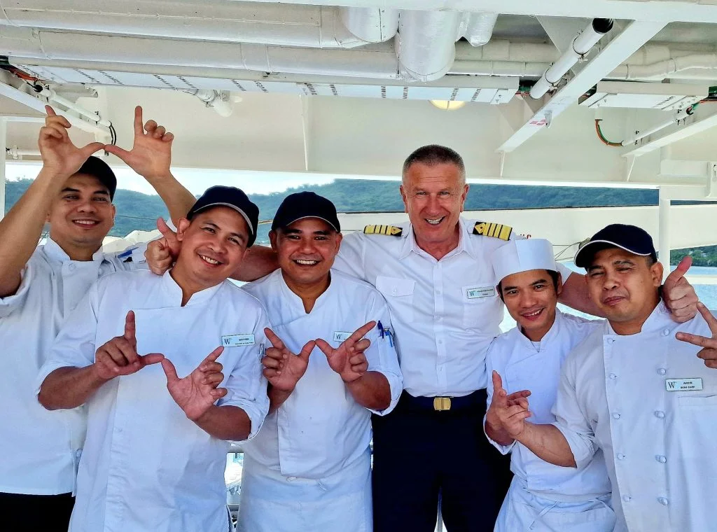 Image of Crewing agency client Windstar Crew smiling at the camera, stood in a line